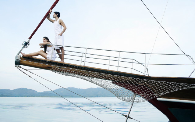 Man woman boat sailboat mountains free wallpaper for desktop - medium preview image