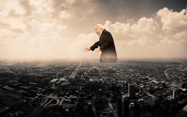 Flying man city sky clouds free wallpaper for desktop - medium preview image