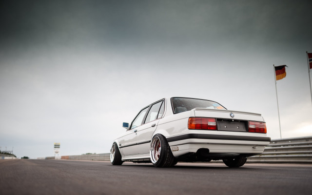 White car flag pole cloudy free wallpaper for desktop - medium preview image