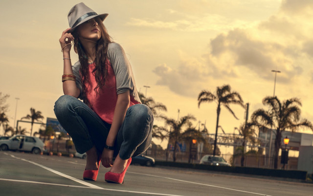Woman kneeling park lot hat free wallpaper for desktop - medium preview image