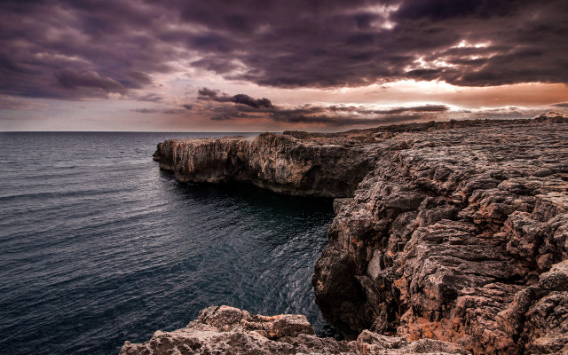 Rocky cliff water cloudy sky #2 free wallpaper for desktop - medium preview image