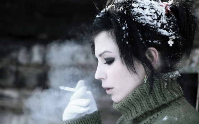 Woman smoking snow green sweater free wallpaper for desktop - medium preview image