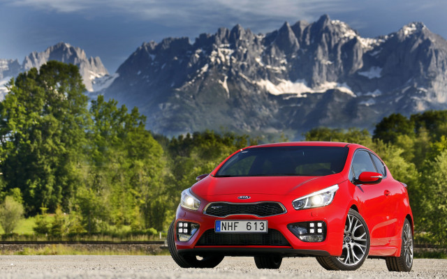 Red car mountain sky trees free wallpaper for desktop - medium preview image