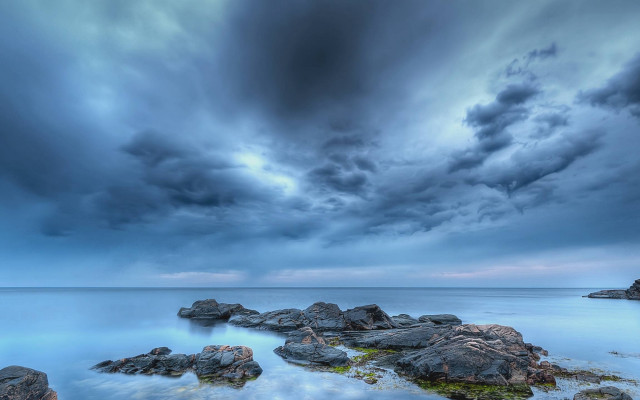 Stormy cloudy sky rocky shore free wallpaper for desktop - medium preview image