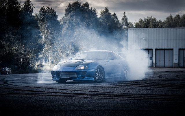 Blue car smoke trees night free wallpaper for desktop - medium preview image