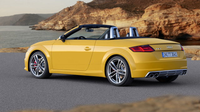 Yellow convertible cliff side road free wallpaper for desktop - medium preview image