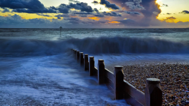 Wave fence beach sunset lighthouse free wallpaper for desktop - medium preview image