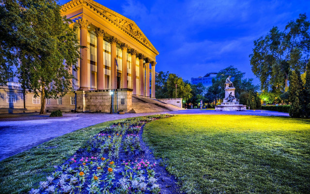 Clock tower building flowers night free wallpaper for desktop - medium preview image