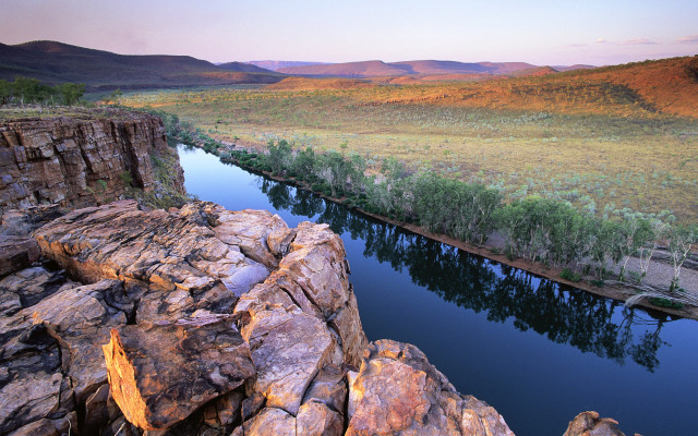 Lush green river valley hillside free wallpaper for desktop - medium preview image