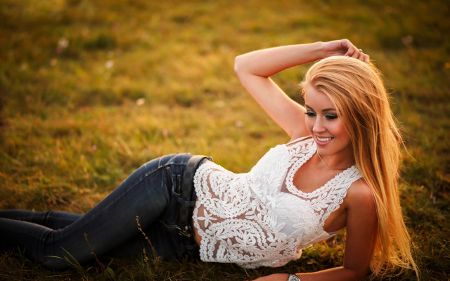 Woman lying field blonde denim free wallpaper for desktop - medium preview image