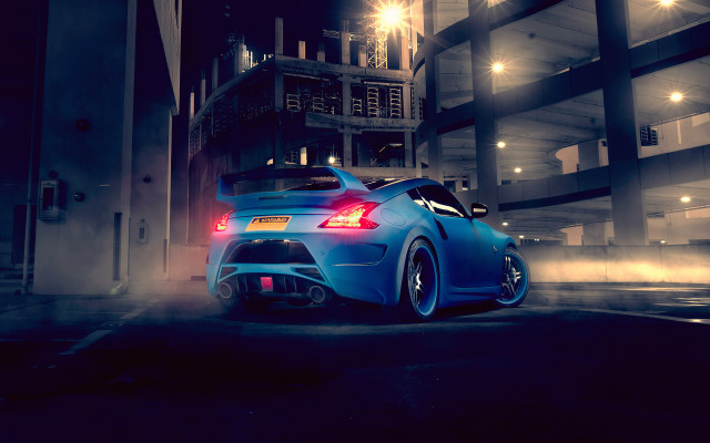 Blue car tall building night free wallpaper for desktop - medium preview image