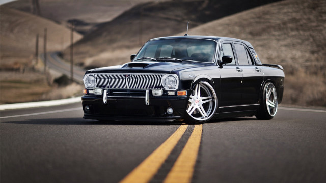 Black car country side hill free wallpaper for desktop - medium preview image