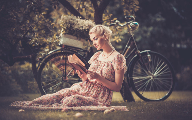 Woman sitting grass reading bicycle free wallpaper for desktop - medium preview image