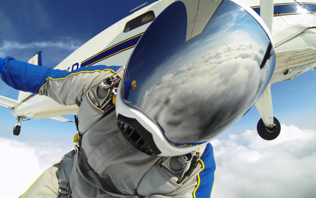 Man space suit flying plane free wallpaper for desktop - medium preview image