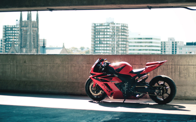 Red motorcycle cityscape tiltshift photorealism free wallpaper for desktop - medium preview image