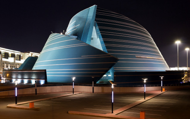 Curved roof building night lights free wallpaper for desktop - medium preview image