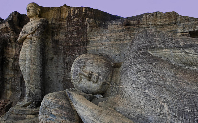 Statue mountain cliff purple sky free wallpaper for desktop - medium preview image