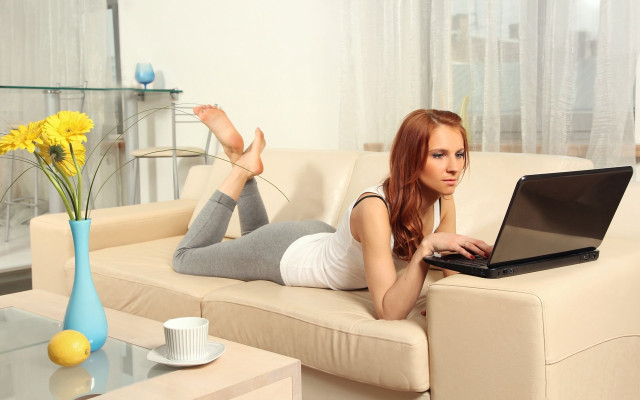 Woman laying couch laptop flowers free wallpaper for desktop - medium preview image