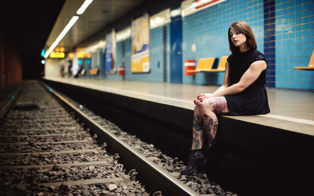 Woman sitting train track portrait free wallpaper for desktop - medium preview image