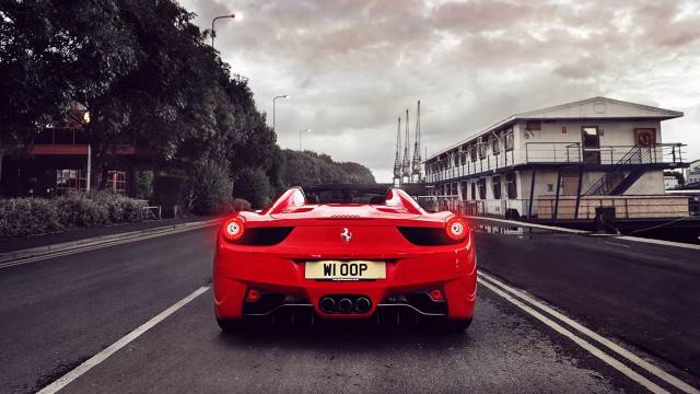 Red sports car cityscape cloudy free wallpaper for desktop - medium preview image