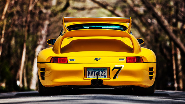 Yellow sports car parked street free wallpaper for desktop - medium preview image