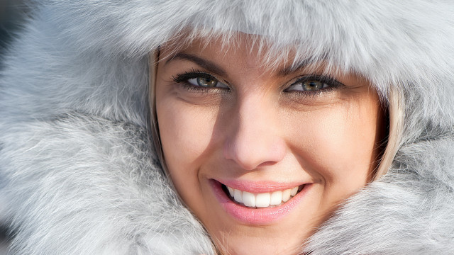Woman furcoat smile white teeth free wallpaper for desktop - medium preview image