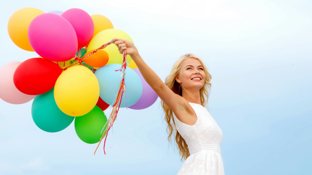 Woman balloons smiling blue sky free wallpaper for desktop - medium preview image