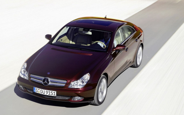 Maroon car driving white wall free wallpaper for desktop - medium preview image