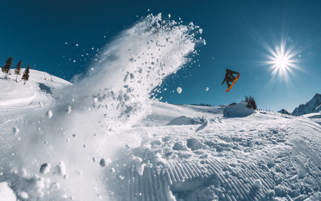 Snowboard jump sunny sky starry free wallpaper for desktop - medium preview image