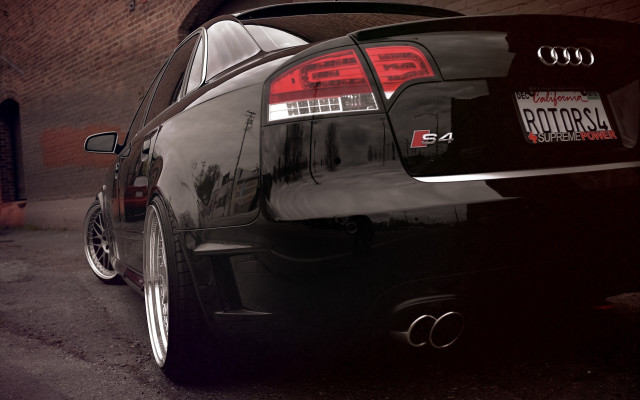 Black car brick building tail free wallpaper for desktop - medium preview image