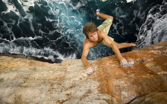 Cliff climber surfboard bottle beach free wallpaper for desktop - medium preview image