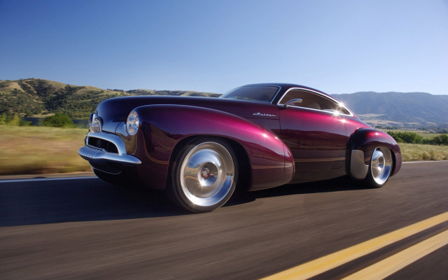 Purple car green hills mountains free wallpaper for desktop - medium preview image