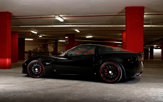 Black sports car red pillars free wallpaper for desktop - medium preview image