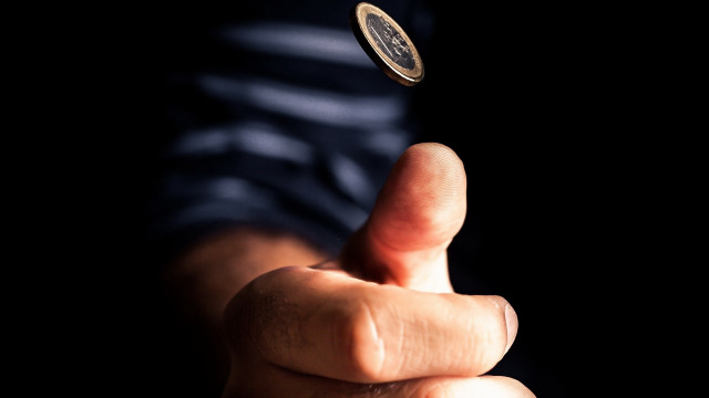 Coin throwing finger catch abstract free wallpaper for desktop - medium preview image