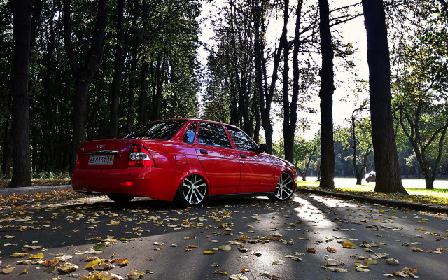 Red car parked road autumn free wallpaper for desktop - medium preview image