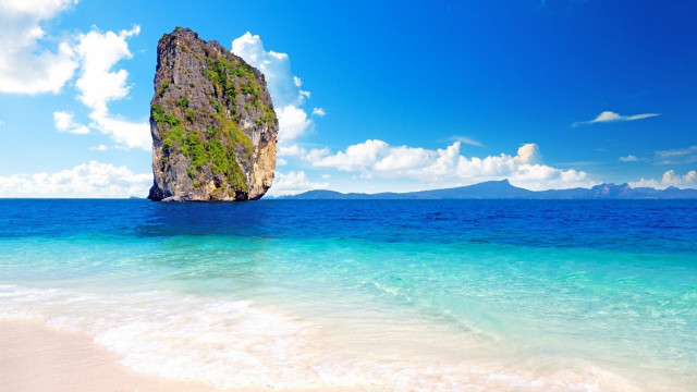 Rock ocean beach clouds sky free wallpaper for desktop - medium preview image