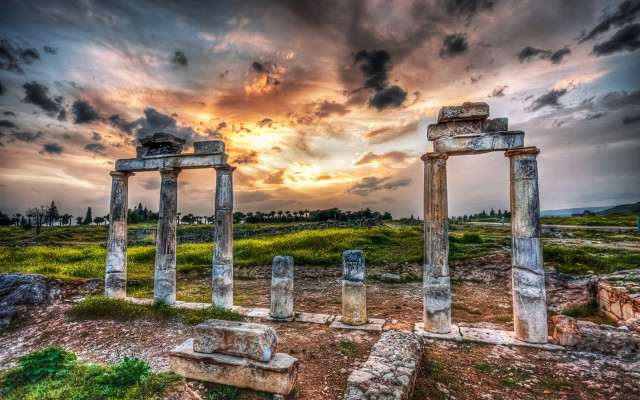 Stone pillars field cloudy sky free wallpaper for desktop - medium preview image
