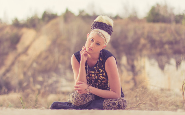 Woman sitting serious face nature free wallpaper for desktop - medium preview image