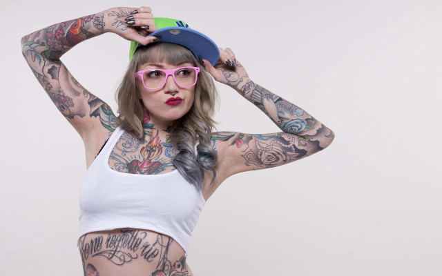 Tattooed woman hat glasses bodyart free wallpaper for desktop - medium preview image