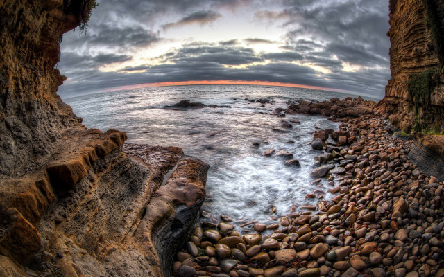 Rocky beach sunset horizon ocean free wallpaper for desktop - medium preview image