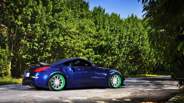 Blue sports car parked rim free wallpaper for desktop - medium preview image