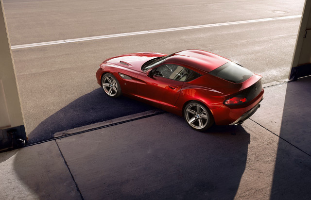 Red sports car parked roadside free wallpaper for desktop - medium preview image