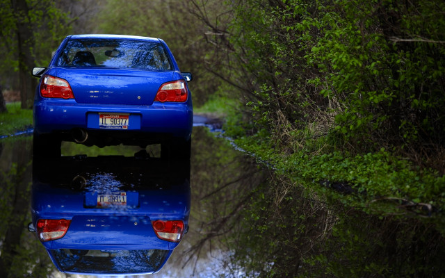 Blue car parked reflections forest free wallpaper for desktop - medium preview image
