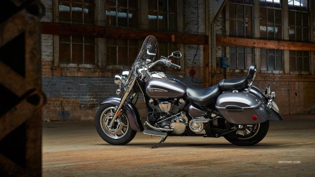 Motorcycle parked garage building windows free wallpaper for desktop - medium preview image