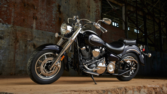 Motorcycle parked brick wall warehouse free wallpaper for desktop - medium preview image