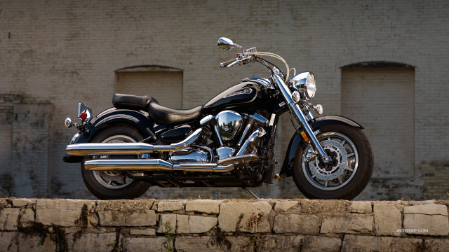 Motorcycle parked stone wall brick free wallpaper for desktop - medium preview image