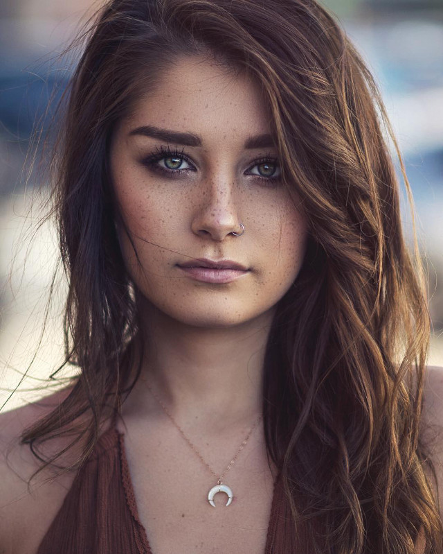 Woman freckles necklace serious look free wallpaper for mobile - medium preview image