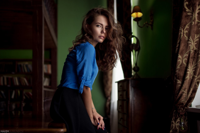 Woman blue shirt leaning table free wallpaper for desktop - medium preview image
