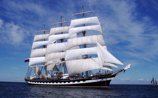 Sailboat ocean blue sky clouds free wallpaper for desktop - medium preview image