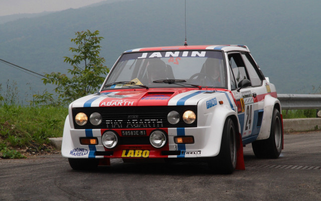 Rally car mountains road person free wallpaper for desktop - medium preview image